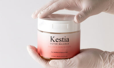 Kestia Balance Serum Pads jar held in hand